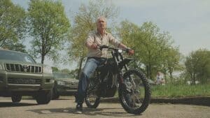 Protect Ukraine co-founder Jaap Scholten on a donated electric motorcycle, designed for silent frontline mobility.