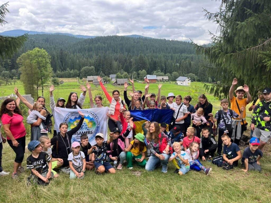 Mothers and children participating in a psychological recovery retreat.